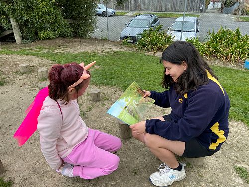 Autumn reading with her buddy Kelly