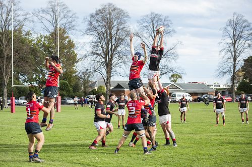 Reach: Jett Anglem towers above as he keeps possession in the hands of St Bede's.