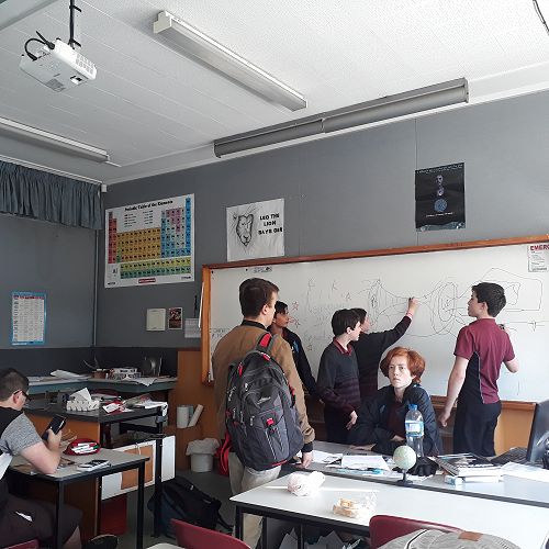 Astronomy students discuss black-hole theories.