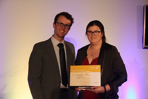 Danyon Thomas presents Sam Strangman with her Gold Community Engagement award
