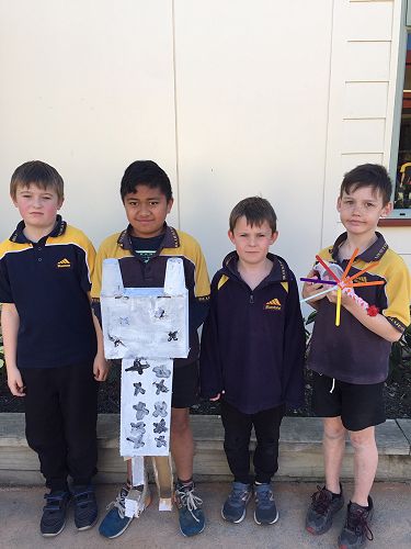 Chevy, Gio, Bryce and Quin with their robot Marshmallow.