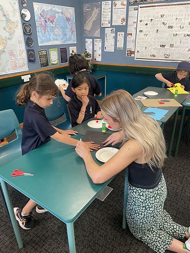 Years 0-3 making their creations.