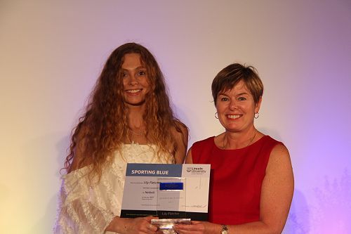 Lily Fletcher receiving her Lincoln University Blue for Netball from Chief Operating Officer Philippa Jones