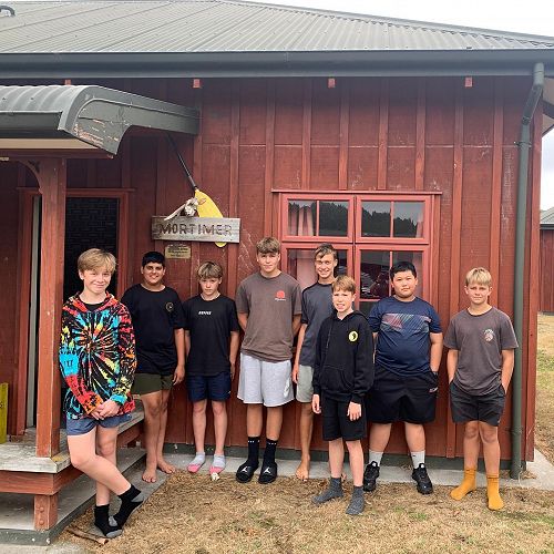 Mortimer boys pose proudly outside their house