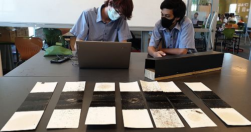 Gabe Robertson and Bradley Powell (Y10 Moana) analyse footprints from 7 ink cards that were placed around the college.
