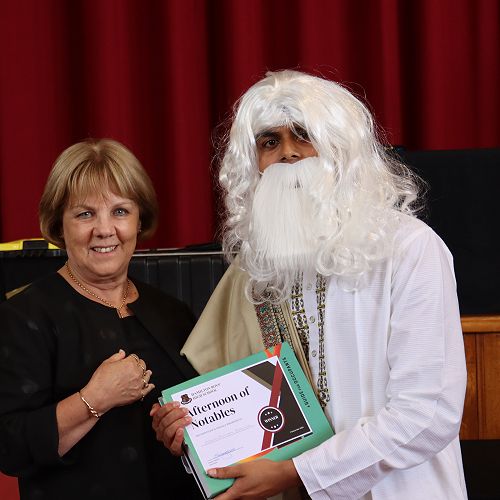 Headmaster, Mrs Hassall, with the winner of the Afternoon of the Notables, Obaidullah Zaman, as Rabindranath Tagore, a Bengali polymath who worked as a poet, writer, playwright, composer, philosopher, social reformer and painter