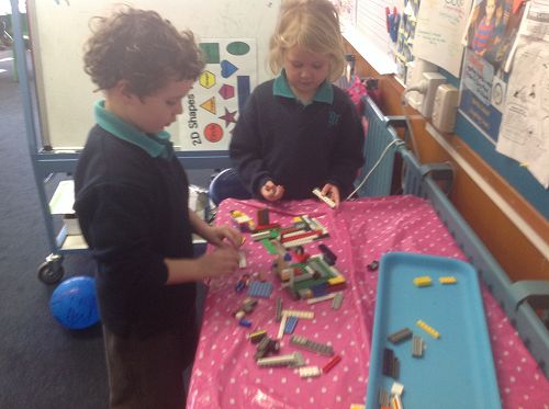 Jacob and Eva discuss their design plans as they work at Imagination Station:-)