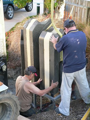 The sculpture is lifted in to place
