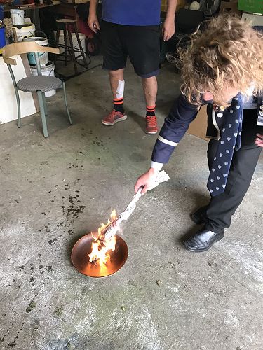 Kyle sets the bail alight.