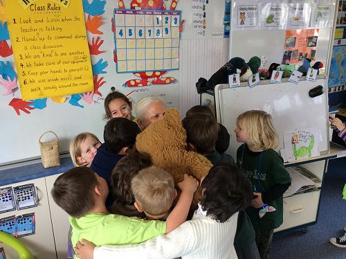 Mrs Augustine being swamped by Rm 14 students!