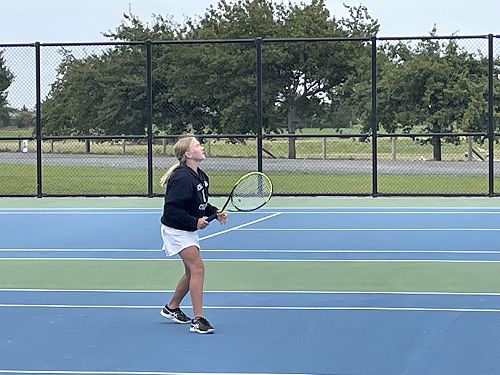 Lining up to take the overhead smash