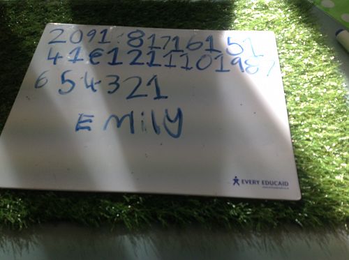 Emily is practising her Math Goal on a whiteboard. Our Math inquiry question for week 5 was "How can I use a number line to help me learn?"  Hoto Emily:-)