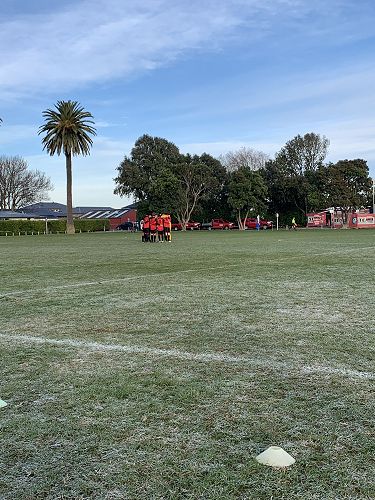 Team huddle before Tauranga game  