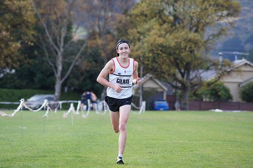 Oliver Chignell comes down the final straight to win the Senior cross country