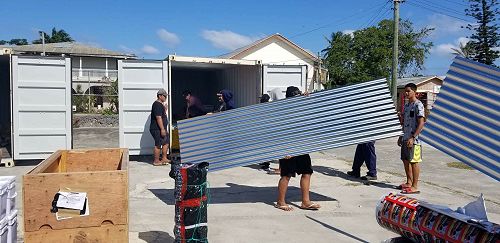 Roofing iron being unloaded at st Paul's Nuku'alofa 