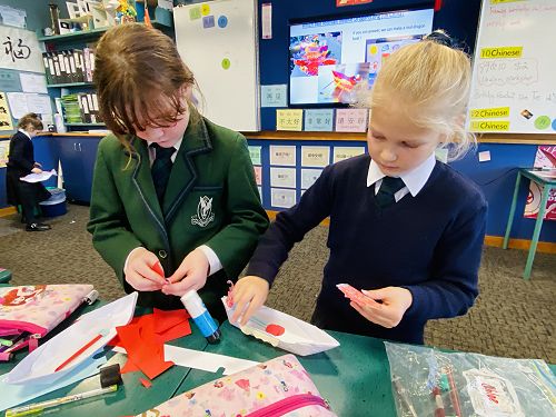 Year 3 Bella Alderson and Michaela Laing making dragon boat
