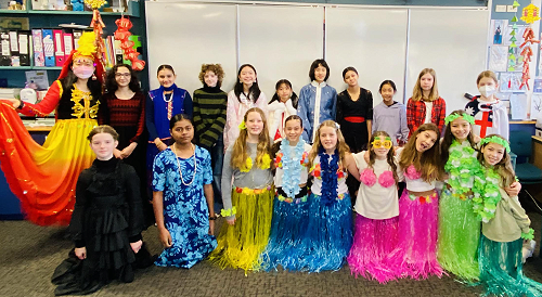 Ms Ding's whanau class in cultural clothing