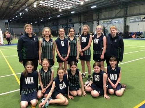 8B Netball team with their Coaches Niamh Paterson and Amelia Findlater