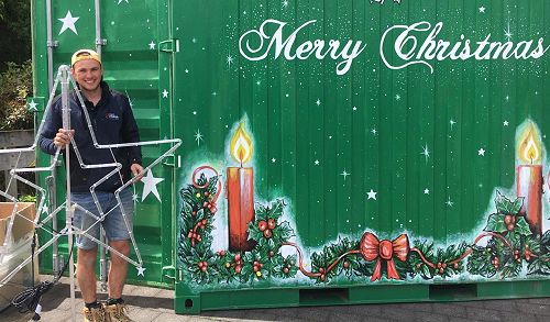 Regan Bray getting ready to test new lights for the Christmas tree lighting ceremony on Thursday, 1 December at Anzac Park, Mosgiel. Image