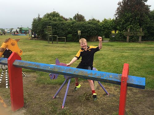 Daniel horse riding in the rain.