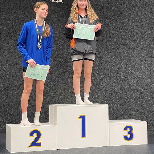 Izzy Arthur receiving her gold metal and certificate.