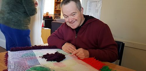 Kenny making his mats