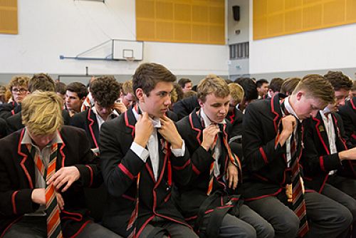 George Chambers putting his leavers tie on in 2016.