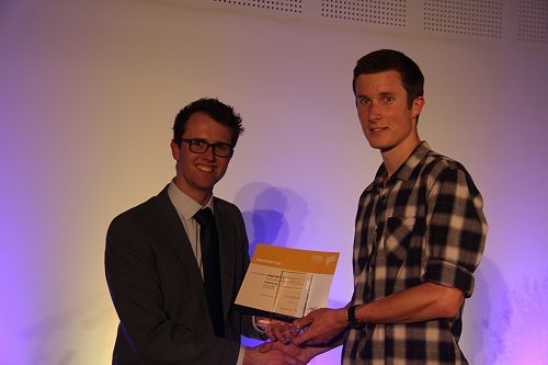 Danyon Thomas presents Joseph Williams with his Gold Award for University Life