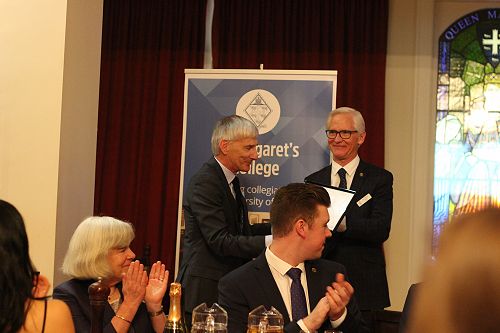 Dr John Heydon (left) receives his Fellow's Certificate from the Master, Dr Charles Tustin