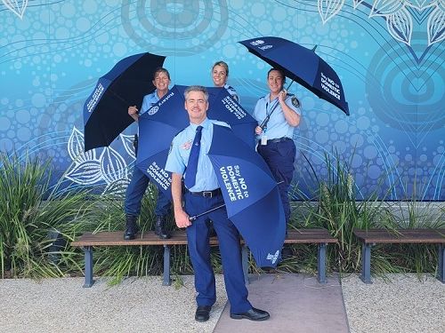 Tweed Umbrellas, Police at Tweed Heads Station showing off the dual
branded Umbrellas