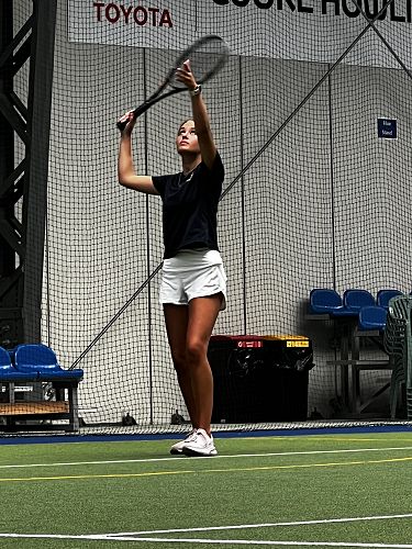 Lilly lines up the serve