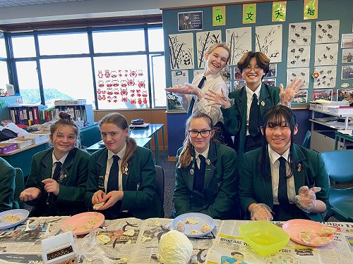 Students making wontons
