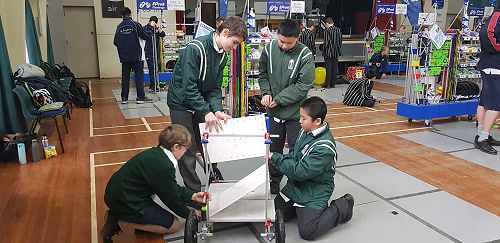 Meticulously building the trolley to carry all the groceries.