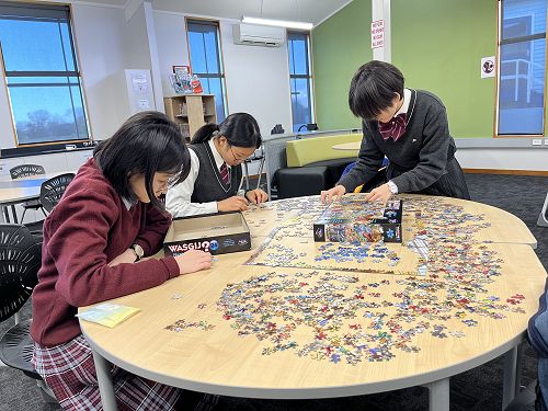 Students enjoying a Wasgij in the Library Learning Centre
