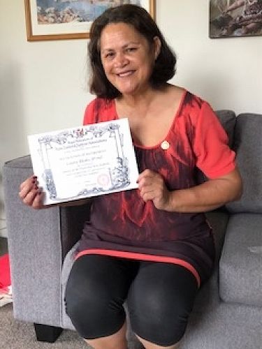 Loretta Rhodes, JP (Retired) with her certificate