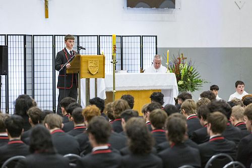 Address: Thomas Langdon shares a reading at the Feast Day Mass.