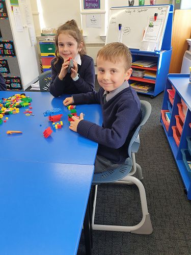 Carson and Maya getting reading to construct