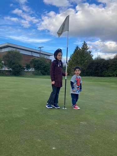 Ngara and her brother out exploring their lock neighbourhood.