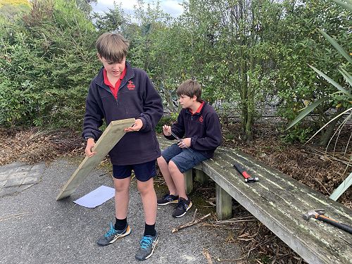 Ben taking a minute to analyse his piece of wood before launching into cutting action. 