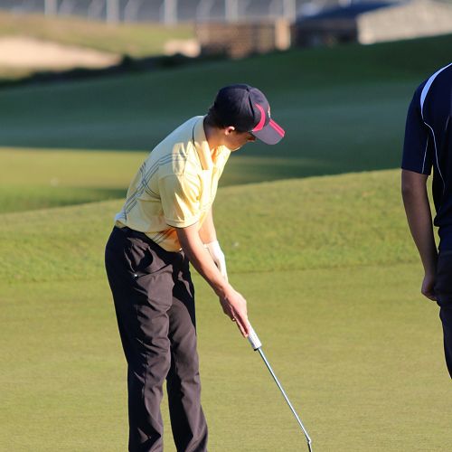 Hamish Brown putts for birdie in the third round of the World School's Golf tournament at the Clearwater Golf course -Christchurch.