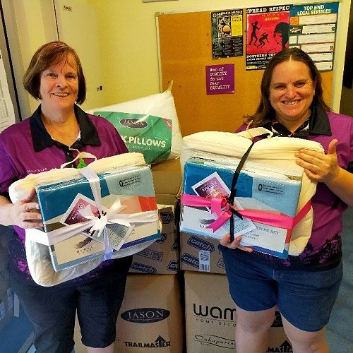 PDG Joanne Schilling and President Neisha delivering the goods to the women’s shelter