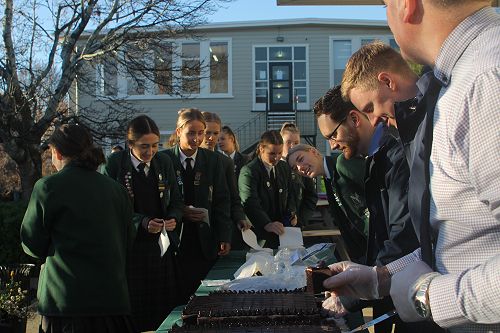 Students lining up for cake