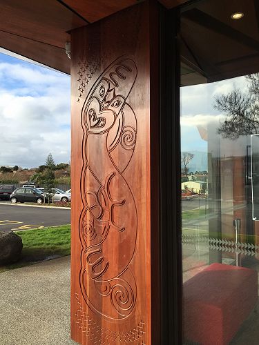 Carving on wall support in Te Oro