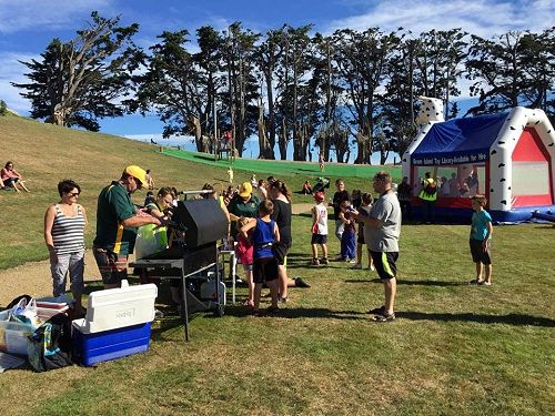 The Green Island Leos helping helping out at the F