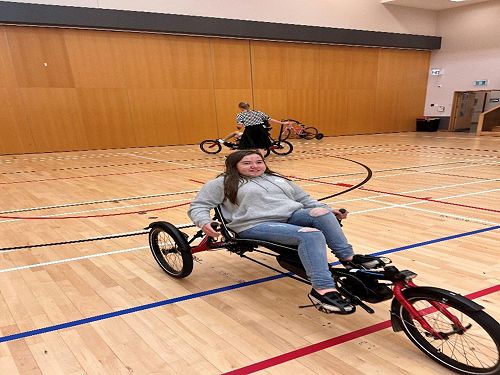 Isabelle trialing the trike