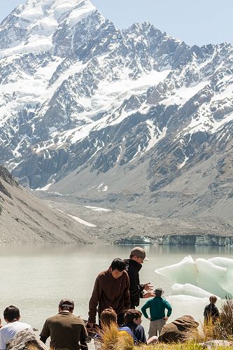 A lazy afternoon in the sun on the shore of the Hooker Glacier terminal lake looking up to Aoraki Mt Cook. 