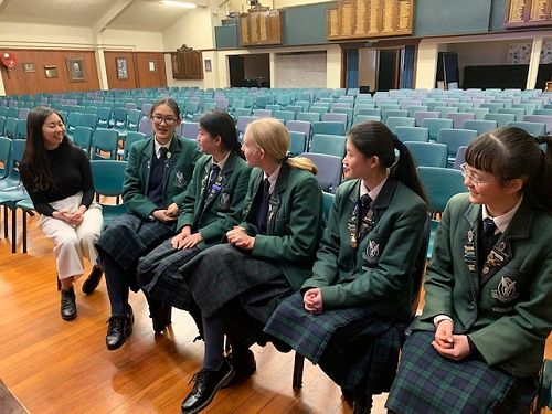 Modi Deng talking with current Columba musicians
