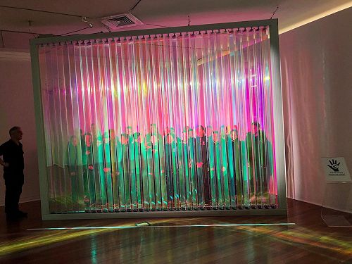 The Year 6 class exploring how reflections can alter with movement and light.