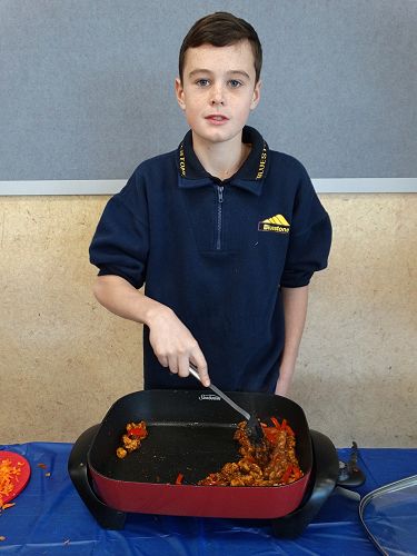 Zac makes sure the meat is evenly cooked
