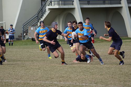 Daniel Sakisi takes advantage of a half gap against Scots College of Sydney